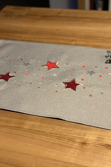 Mantel navideño bordado gris con copos rojos
