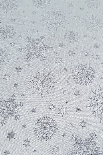 Tela decorativa lisa con estampado de copos de color gris.