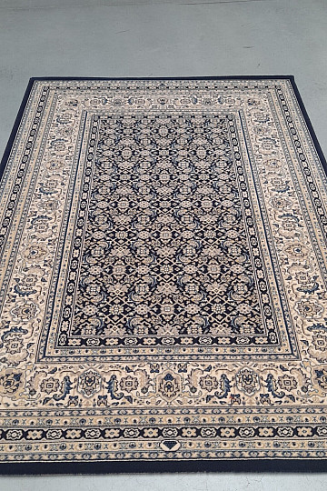 Alfombra clásica de lana ORIENT con estampado azul en toda su superficie