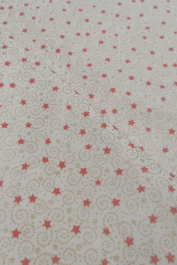 Tela navideña de algodón color crema con miniestrellitas