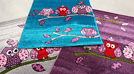 Alfombras con búhos, pájaros.