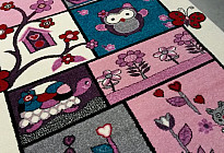 Alfombras con búhos, pájaros.