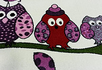 Alfombras con búhos, pájaros.