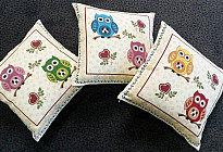 Almohadas con búhos