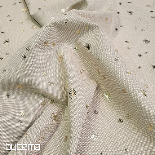 Tela CANVAS de algodón ESTRELLAS DORADAS sobre la tabla de cortar