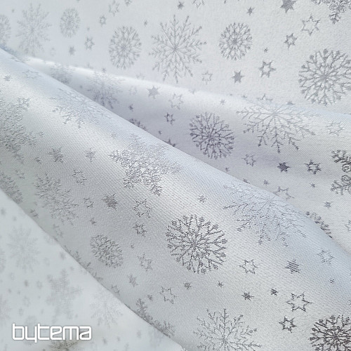 Tela decorativa lisa con estampado de copos de color gris.