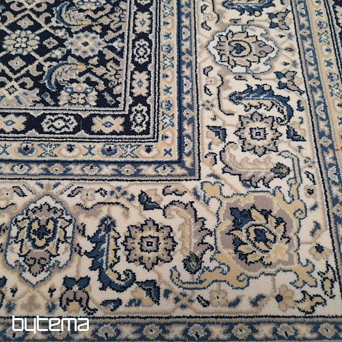 Alfombra clásica de lana ORIENT con estampado azul en toda su superficie