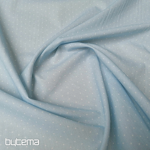 Tela de algodón con lunares azules.